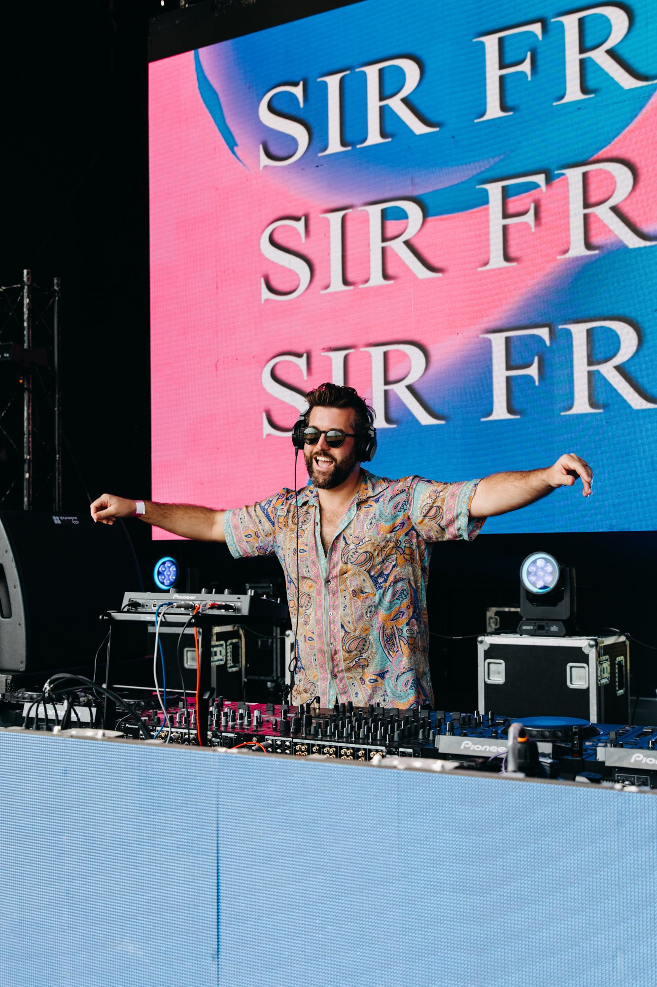 Sir Francis on a festival stage in front of a Sir Francis LED wall